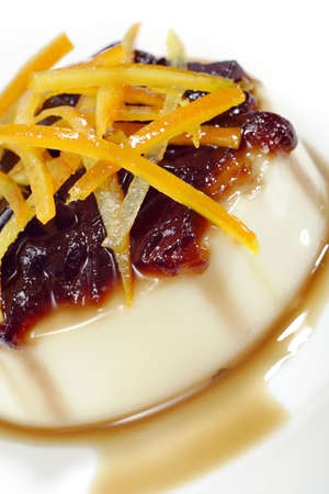 Vanilia pudding with gelled coffee sauce and orange peel