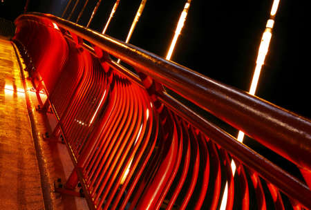 Pedestrian bridge barrier at nightの写真素材