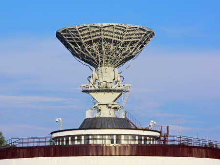 Telecommunication satellite antenna on top of building