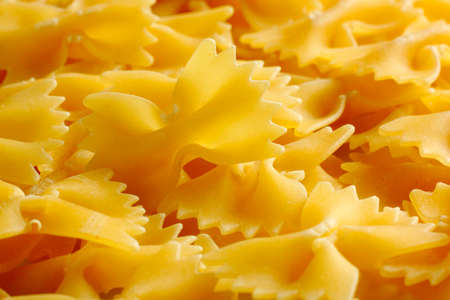 Raw farfalle pasta. Full frame, close up view.