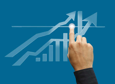 hand business touch point of the graph on screenの写真素材
