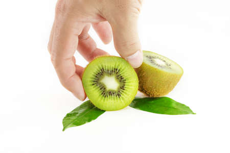 healthy man hand pick slice kiwi on whiteの写真素材
