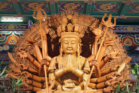 THE THOUSAND-ARMED Chinese Buddha Golden statueの写真素材