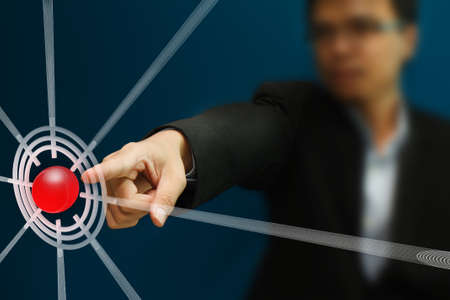Business man pointing to the target on touch screen