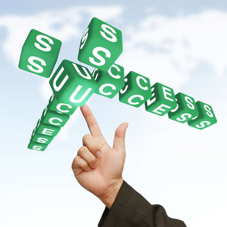 Businessman Hand and word Success, business concept, on world map sky backgroundの写真素材