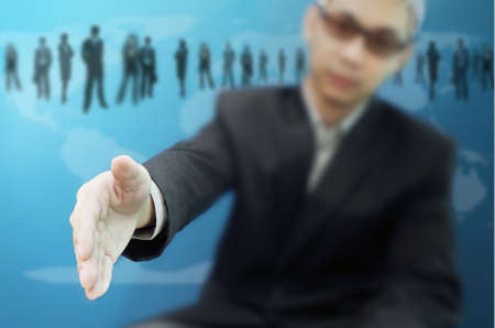 Executive extending hand to shakeの写真素材