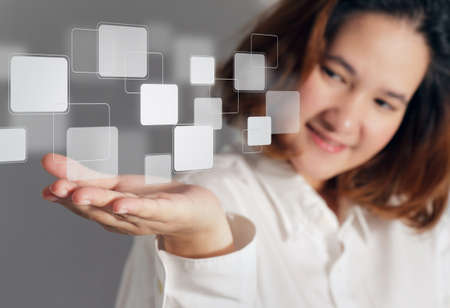 business hand holding on a touch screen interfaceの写真素材