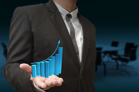 Business hand hold rising green graphの写真素材