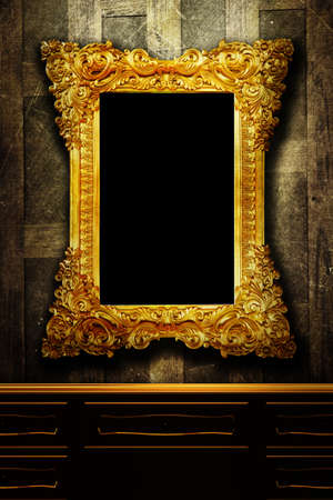 Gallery display - vintage gold frames on an old timber wallの写真素材