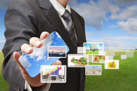 businessman holding on a touch screen interface businessman holding on a touch screen interface