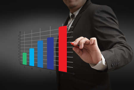 businessman draws a chart business