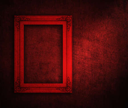 picture frame on red paint wallの写真素材