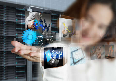 businesswoman shows streaming images and server room background