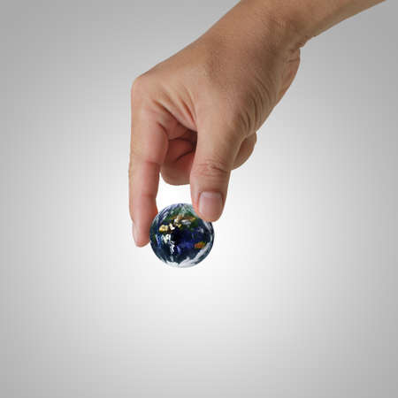 hand pick the earth Elements of this image furnished by NASA の写真素材