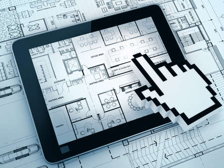 hand cursor point on layout drawing with tablet computerの写真素材