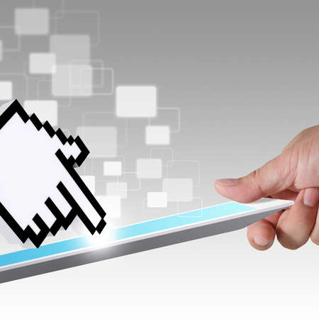 close up of hand holds tablet computer and hand cursor and virtual buttonの写真素材