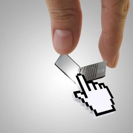 close of hand picks laptop with 3d cursor handの写真素材