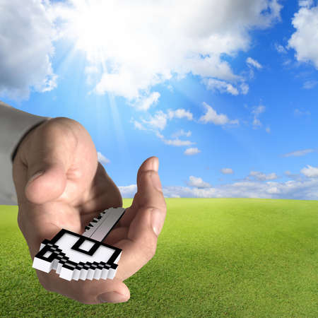 hand offers house key as conceptの写真素材