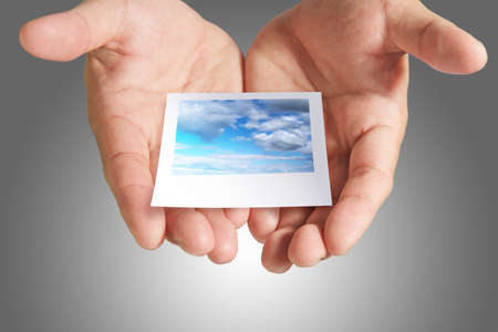 cloud instant photo in handの写真素材