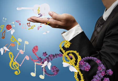 musician shows classical guitar and flower music as conceptの写真素材