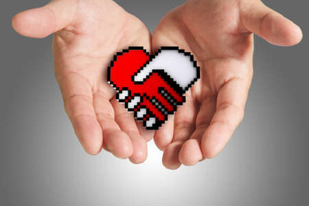 hand shows hand shake, heart shaped symbol as medical technology,clipping pathの写真素材