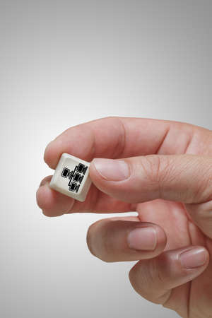 close up of hand picks pixel 3d cloud network sign icon as conceptの写真素材