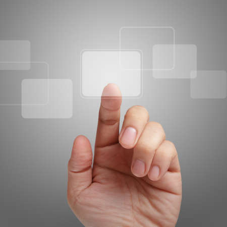 male hand point on touch screen interface as conceptの写真素材