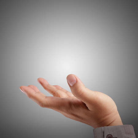 Empty open hand on darkの写真素材