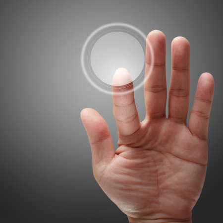 male hand pushing on touch screen interface as conceptの写真素材