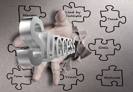 male hand breaking through texture paper and silver success diagram as conceptの写真素材