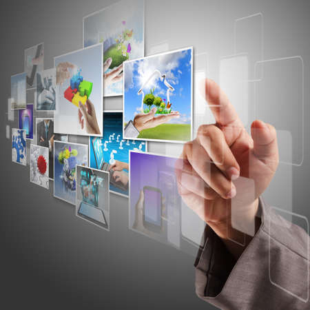 business hand reaching virtual images streaming from the deepの写真素材