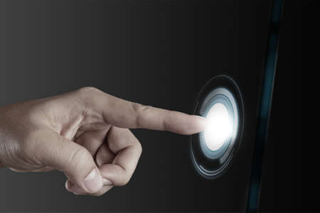 businessman hand pushing on a touch screen interfaceの写真素材