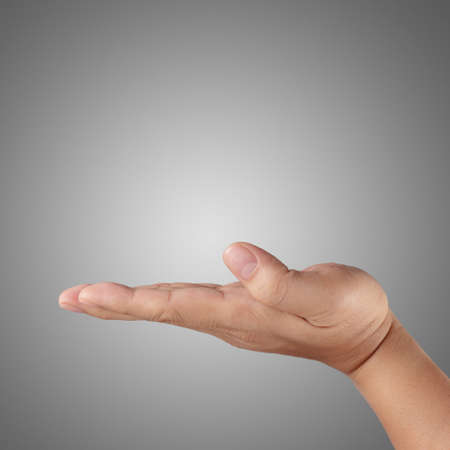 man hand holding isolated on greyの写真素材