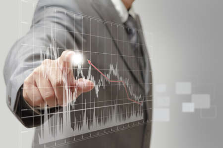 a business man hand graph