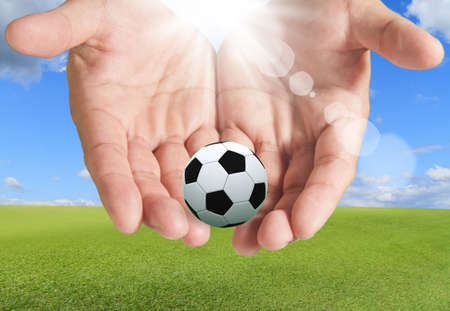 Hands With Soccer Ball skyの写真素材