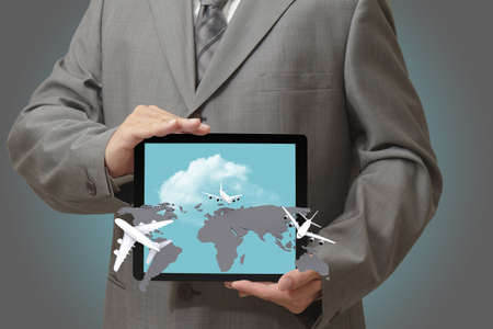 Modern people doing business, graphs and charts being demonstrated on the screen of a touch-pad