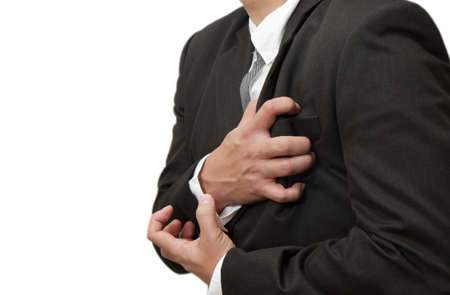 Senior man having a heart attack isolated on white backgroundの写真素材