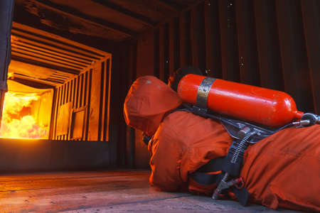 Firefighters fighting fire during trainingの写真素材