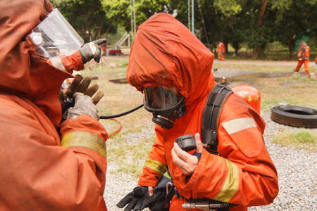 Firefighters fighting fire during trainingの写真素材