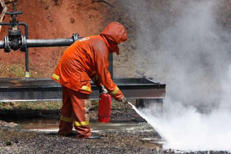 Firefighters fighting fire during trainingの写真素材