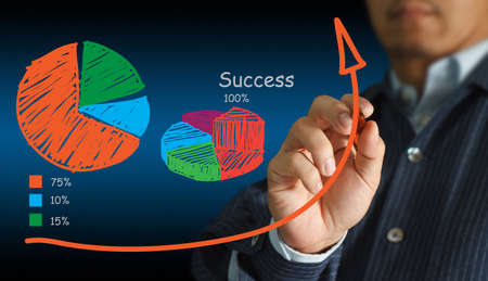 Young stylish businessman touching virtual interface buttonの写真素材