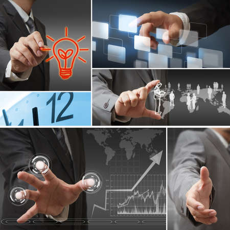 Young stylish businessman touching virtual interface buttonの写真素材
