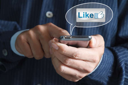 Touch screen mobile phone, in hand