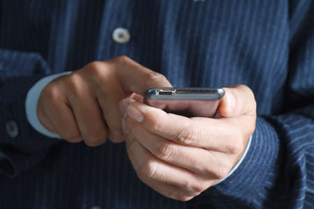Touch screen mobile phone, in handの写真素材