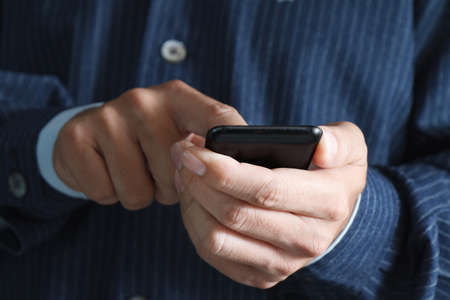 Touch screen mobile phone, in handの写真素材