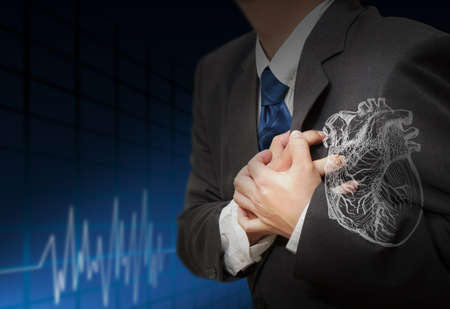Young stylish businessman touching virtual interface buttonの写真素材
