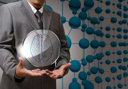 business man hand show brain sign as medical technologyの写真素材