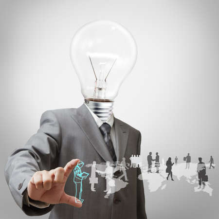 Businessman with light bulb head and employeesの写真素材