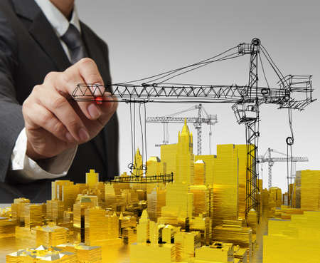 business man hand draws golden building development concept