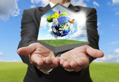 businessman show green earth as conceptの写真素材